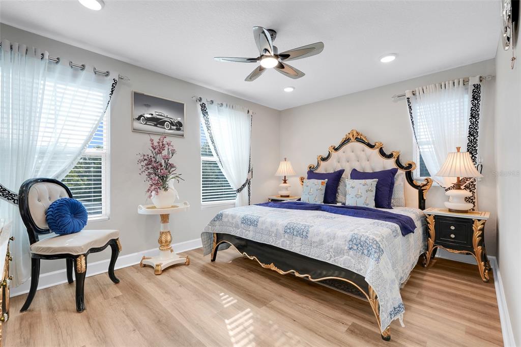 10169 Spring Lake Drive Clermont, FL 34711 - Photo 29 of 54 a bedroom with a bed and window