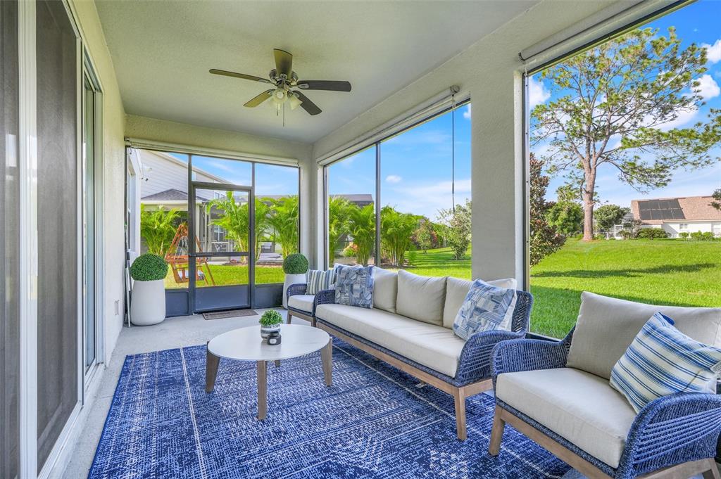 10169 Spring Lake Drive Clermont, FL 34711 - Photo 33 of 54 a living room with furniture and a large window