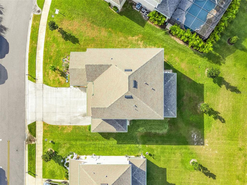 10169 Spring Lake Drive Clermont, FL 34711 - Photo 37 of 54 an aerial view of a house with a yard