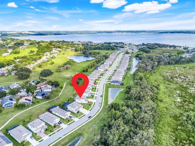 a bedroom with furniture and a chandelier