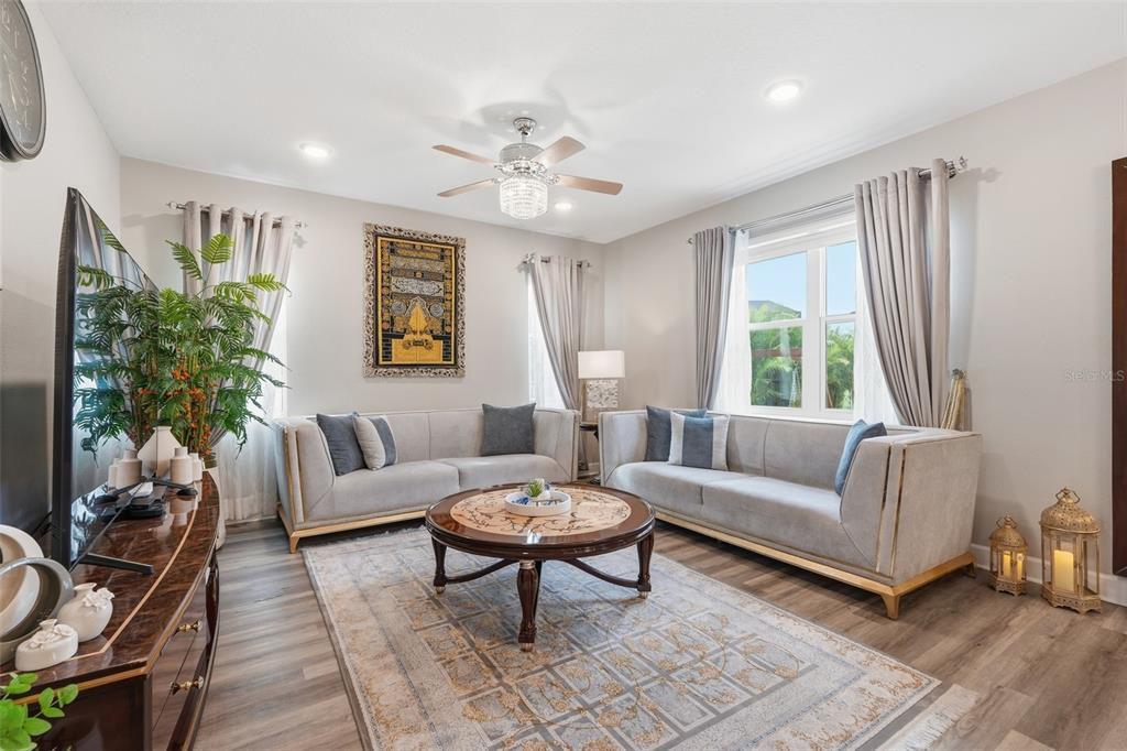 10169 Spring Lake Drive Clermont, FL 34711 - Photo 6 of 54 a living room with furniture and a large window