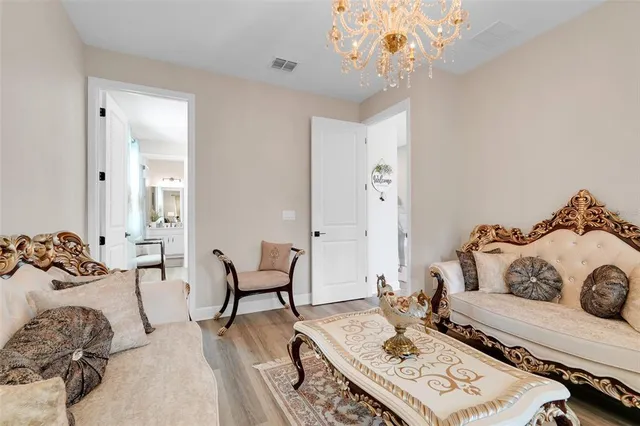 a kitchen with kitchen island granite countertop a sink stove and refrigerator