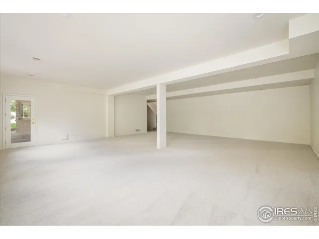 a bed room with a bed window and a chair