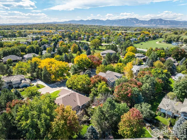 a view of a swimming pool with lounge chairs in patio