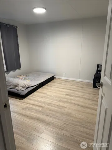 a bedroom with a bed and a shower