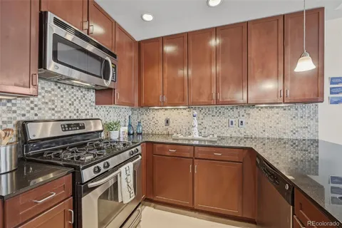 a bathroom with a shower a toilet and a sink