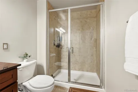 a view of a patio with table and chairs and potted plants