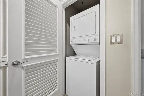 a living room with furniture and flowers