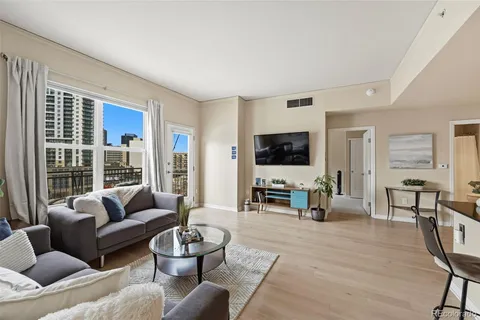 a kitchen with granite countertop cabinets stainless steel appliances and wooden floor