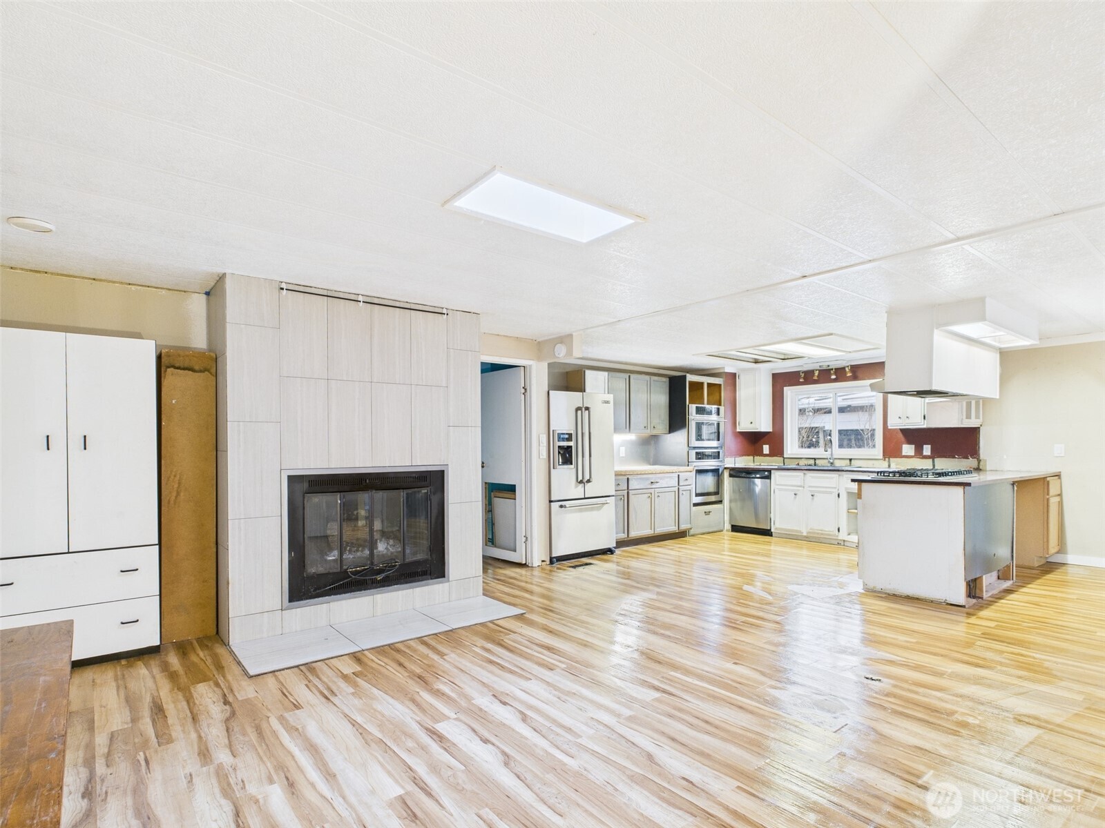 201 Union Avenue Southeast, Unit 183 Renton, WA 98059 - Photo 12 of 30 a living room with furniture and a fireplace