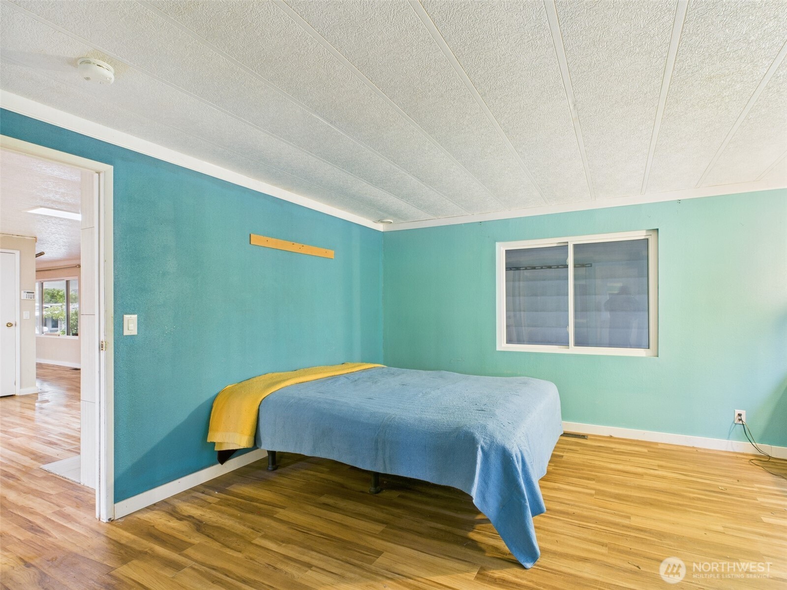 201 Union Avenue Southeast, Unit 183 Renton, WA 98059 - Photo 24 of 30 a bedroom with a bed and a window