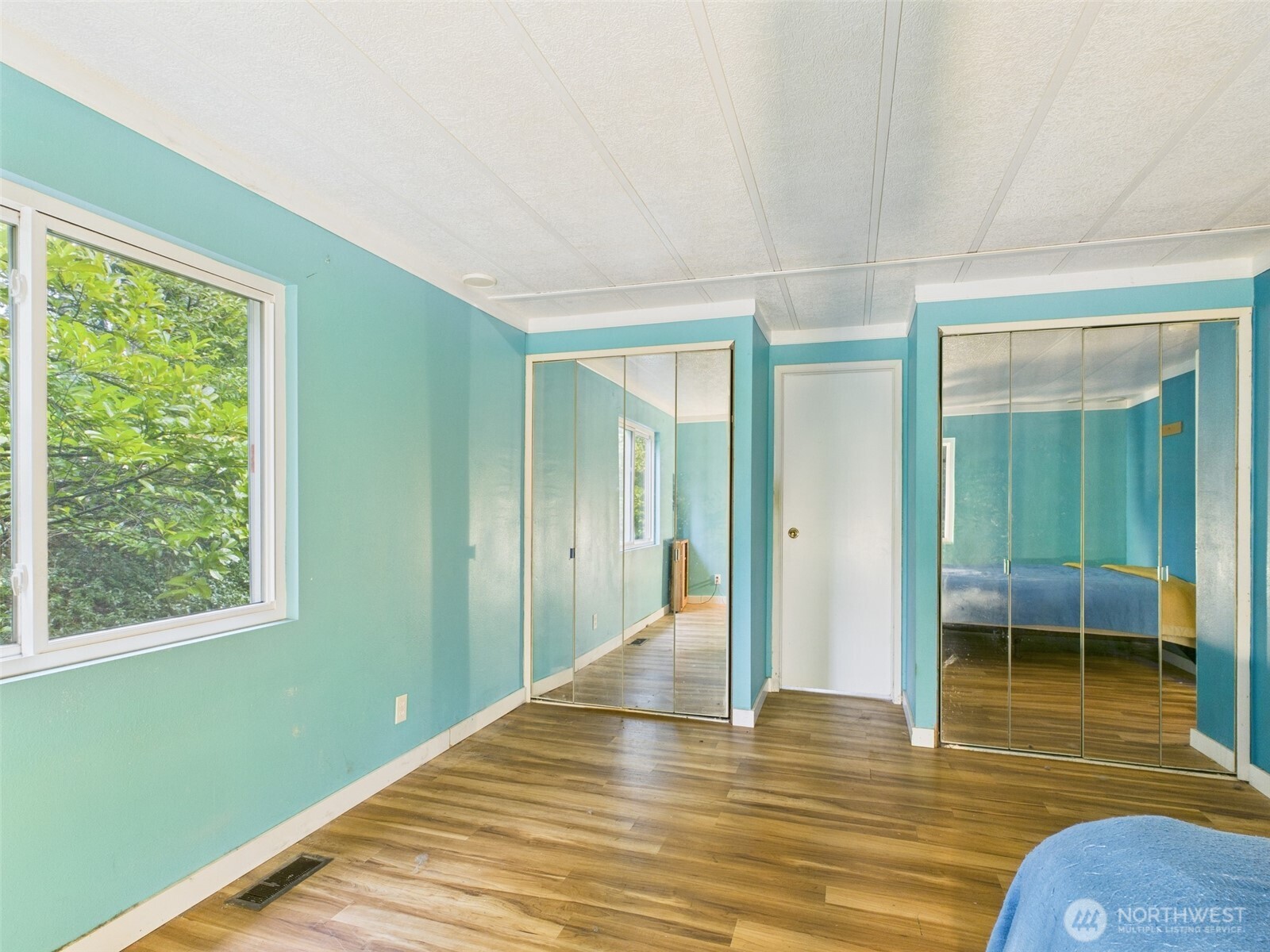 201 Union Avenue Southeast, Unit 183 Renton, WA 98059 - Photo 28 of 30 a view of a room with wooden floor and a window