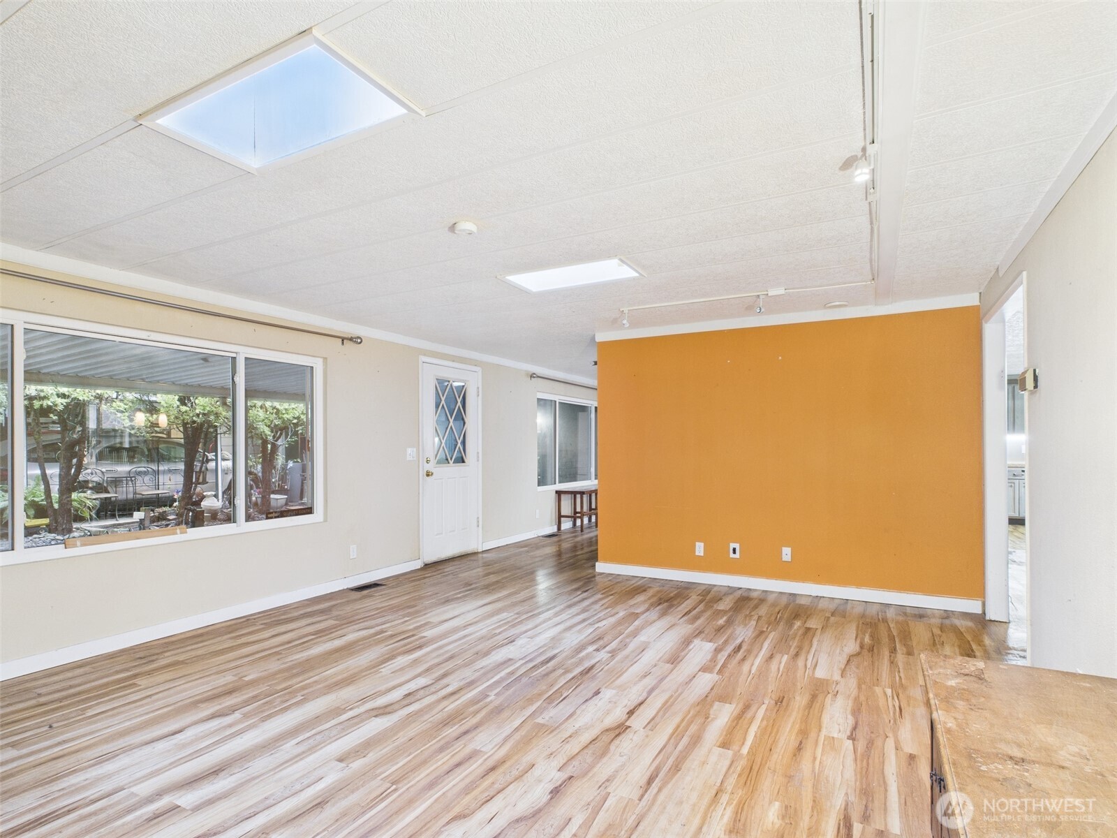 201 Union Avenue Southeast, Unit 183 Renton, WA 98059 - Photo 4 of 30 a view of empty room with wooden floor and fan