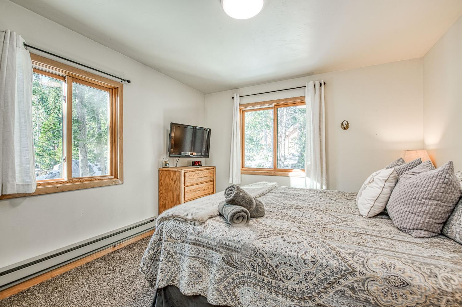 55578 Cordwood Road Shaver Lake, CA 93664 - Photo 20 of 59 a bedroom with a bed furniture and a window