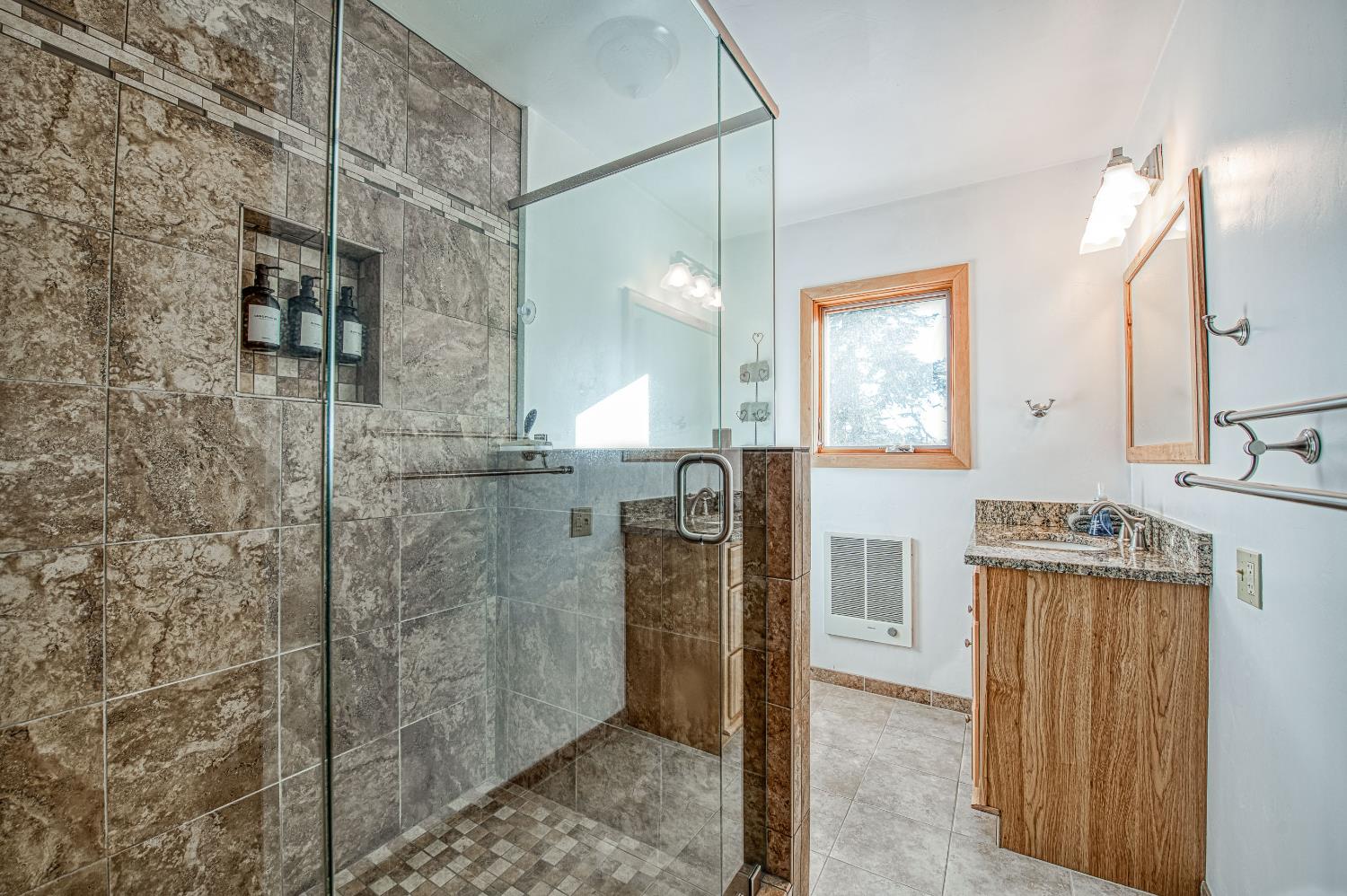 55578 Cordwood Road Shaver Lake, CA 93664 - Photo 29 of 59 a bathroom with a shower