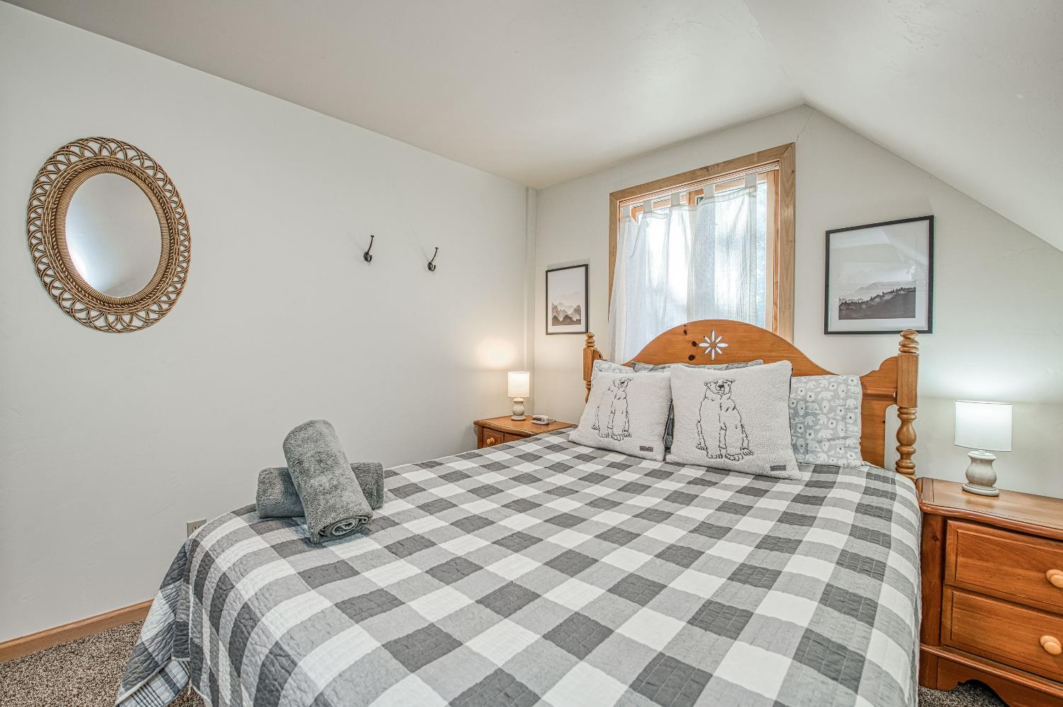 55578 Cordwood Road Shaver Lake, CA 93664 - Photo 31 of 59 a bedroom with a bed and a lamp on dresser