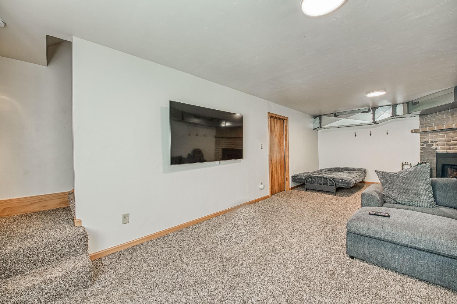 55578 Cordwood Road Shaver Lake, CA 93664 - Photo 35 of 59 a bedroom with furniture and a couch