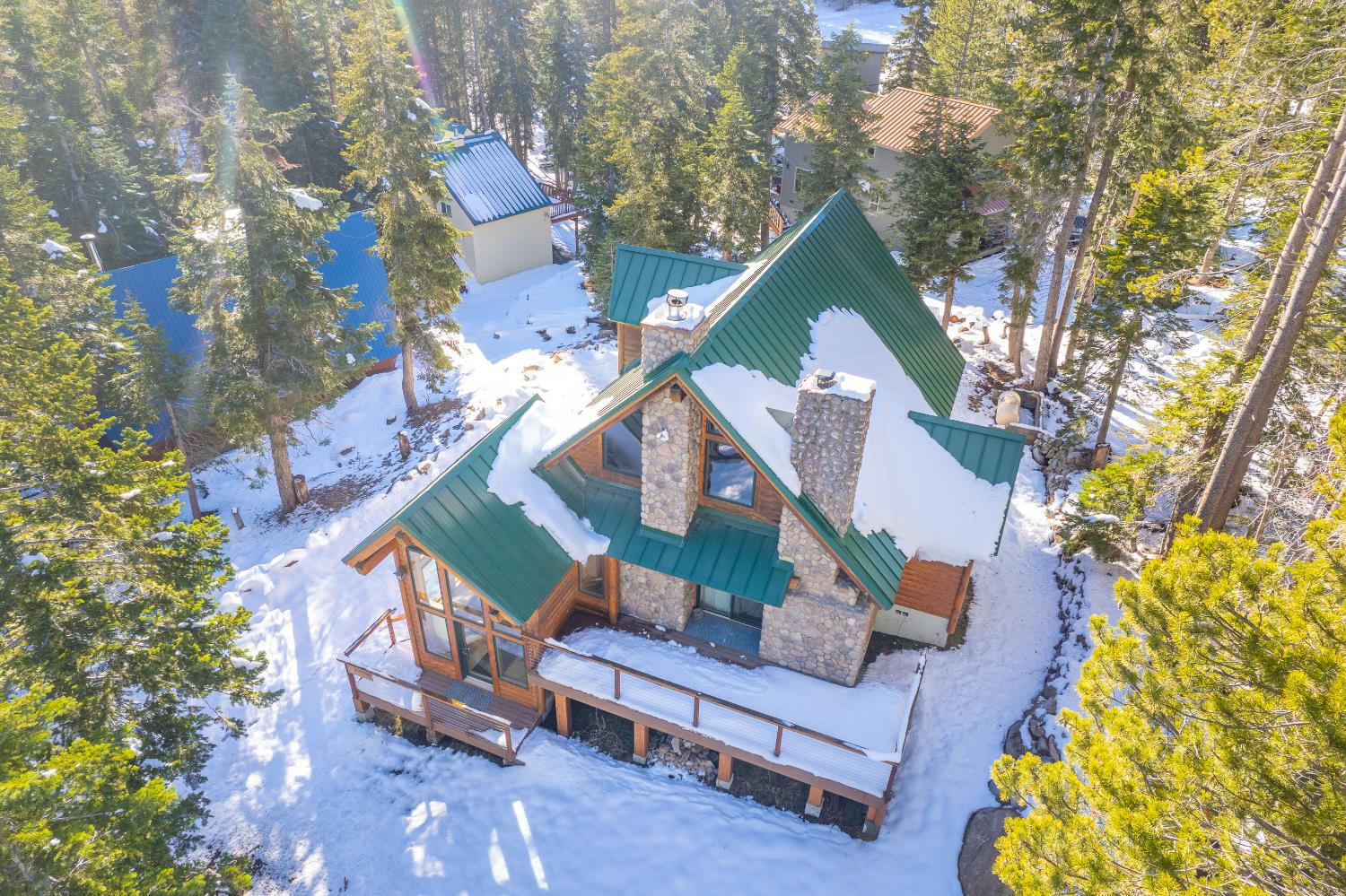 55578 Cordwood Road Shaver Lake, CA 93664 - Photo 40 of 59 a front view of a house with a yard