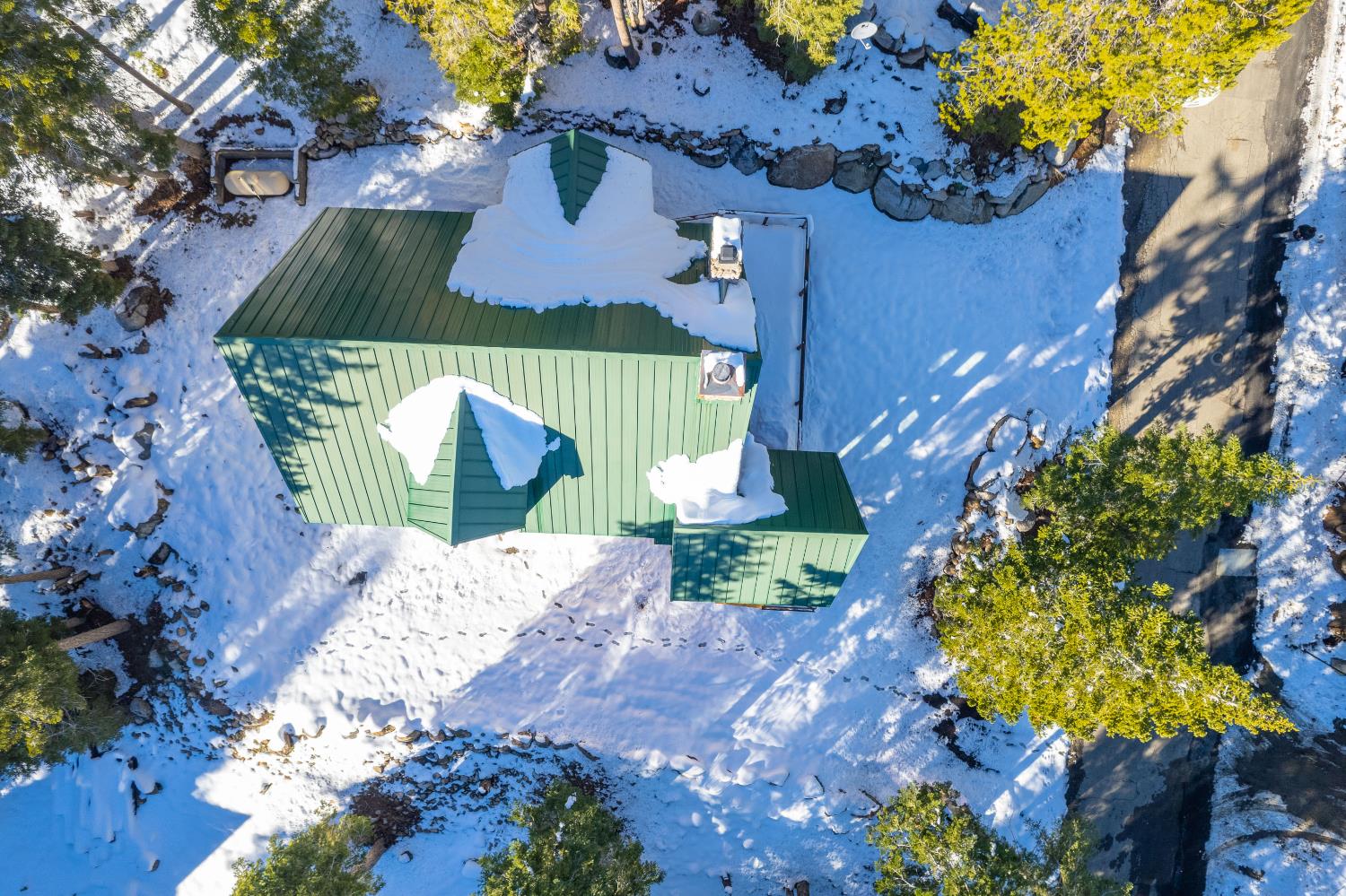 55578 Cordwood Road Shaver Lake, CA 93664 - Photo 43 of 59 a view of a house with a yard