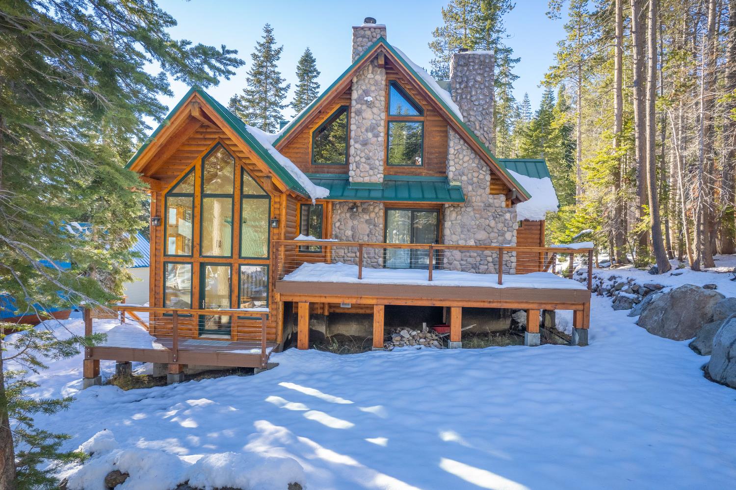 55578 Cordwood Road Shaver Lake, CA 93664 - Photo 53 of 59 a front view of a house with a yard and balcony