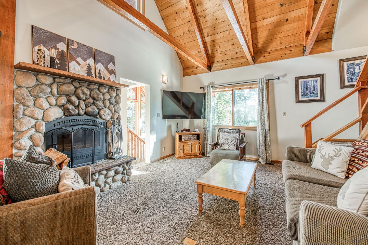 55578 Cordwood Road Shaver Lake, CA 93664 - Photo 10 of 59 a living room with furniture and a fireplace