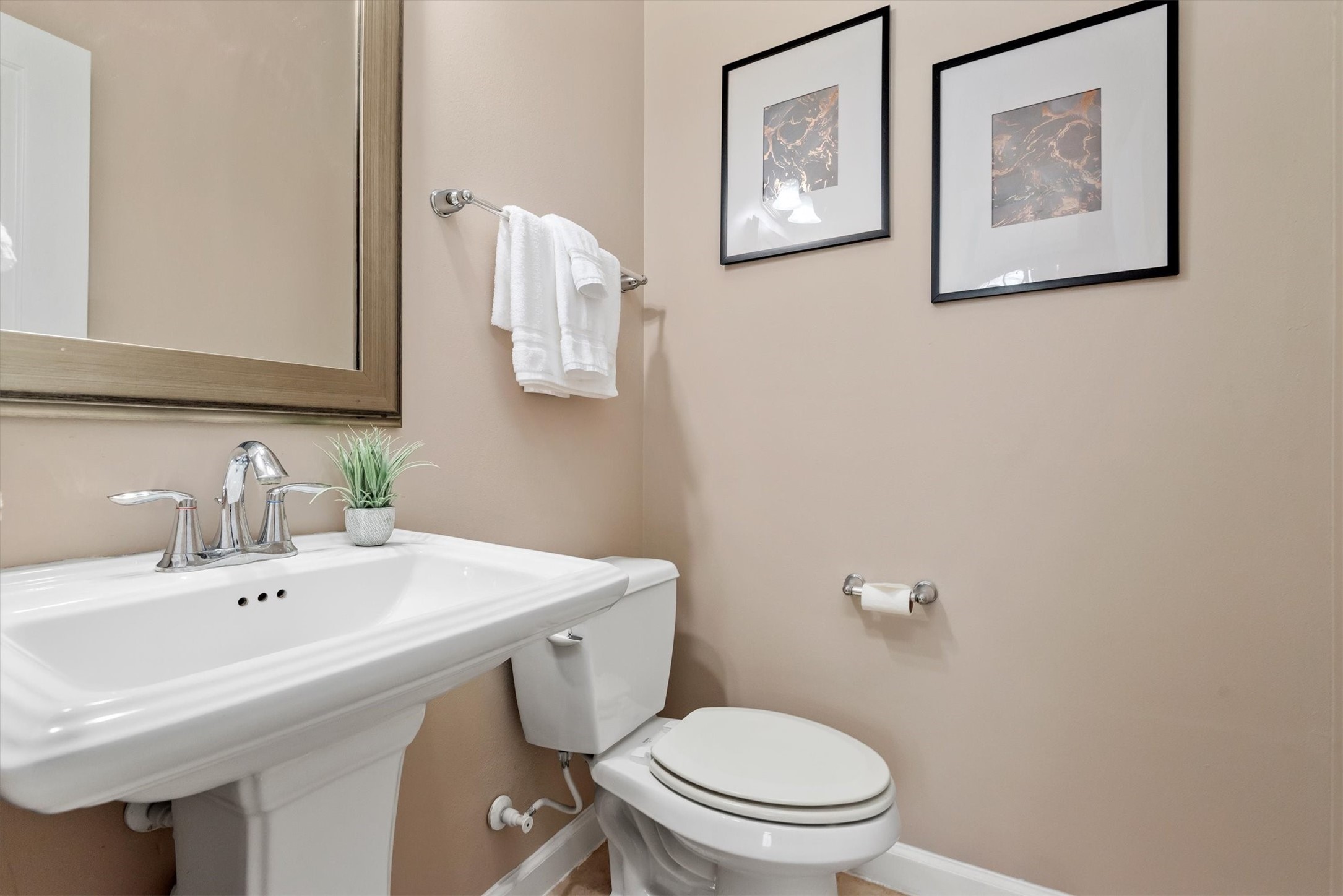 31563 Ember Trail Lane Spring, TX 77386 - Photo 18 of 39 a bathroom with a toilet a sink and mirror