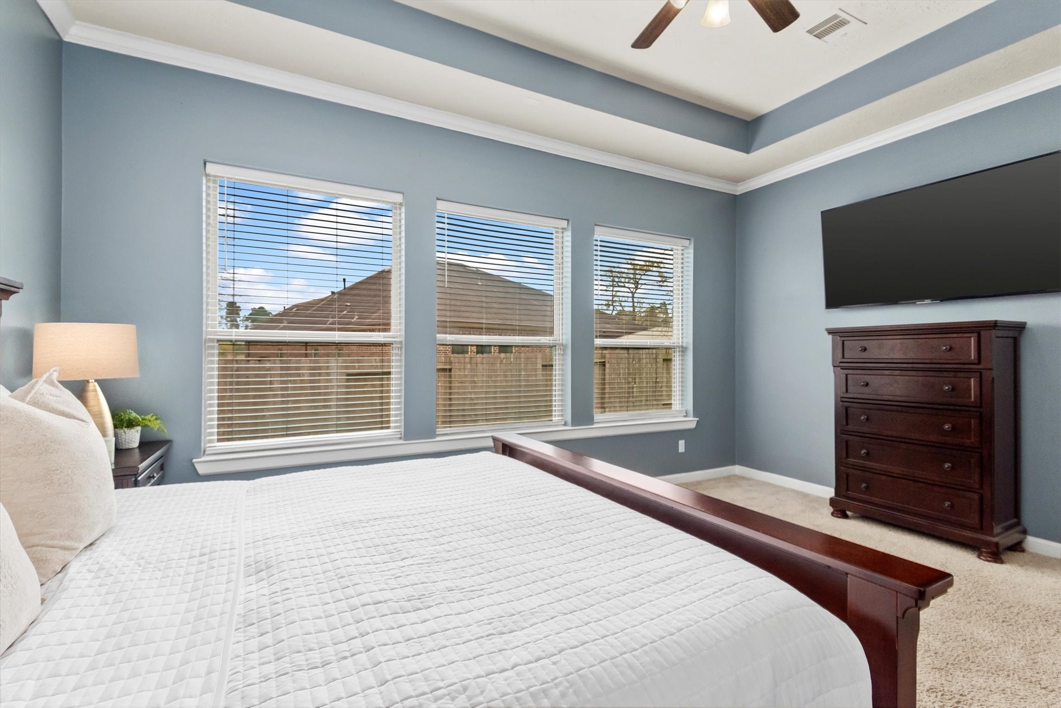31563 Ember Trail Lane Spring, TX 77386 - Photo 21 of 39 a bedroom with a bed and a television
