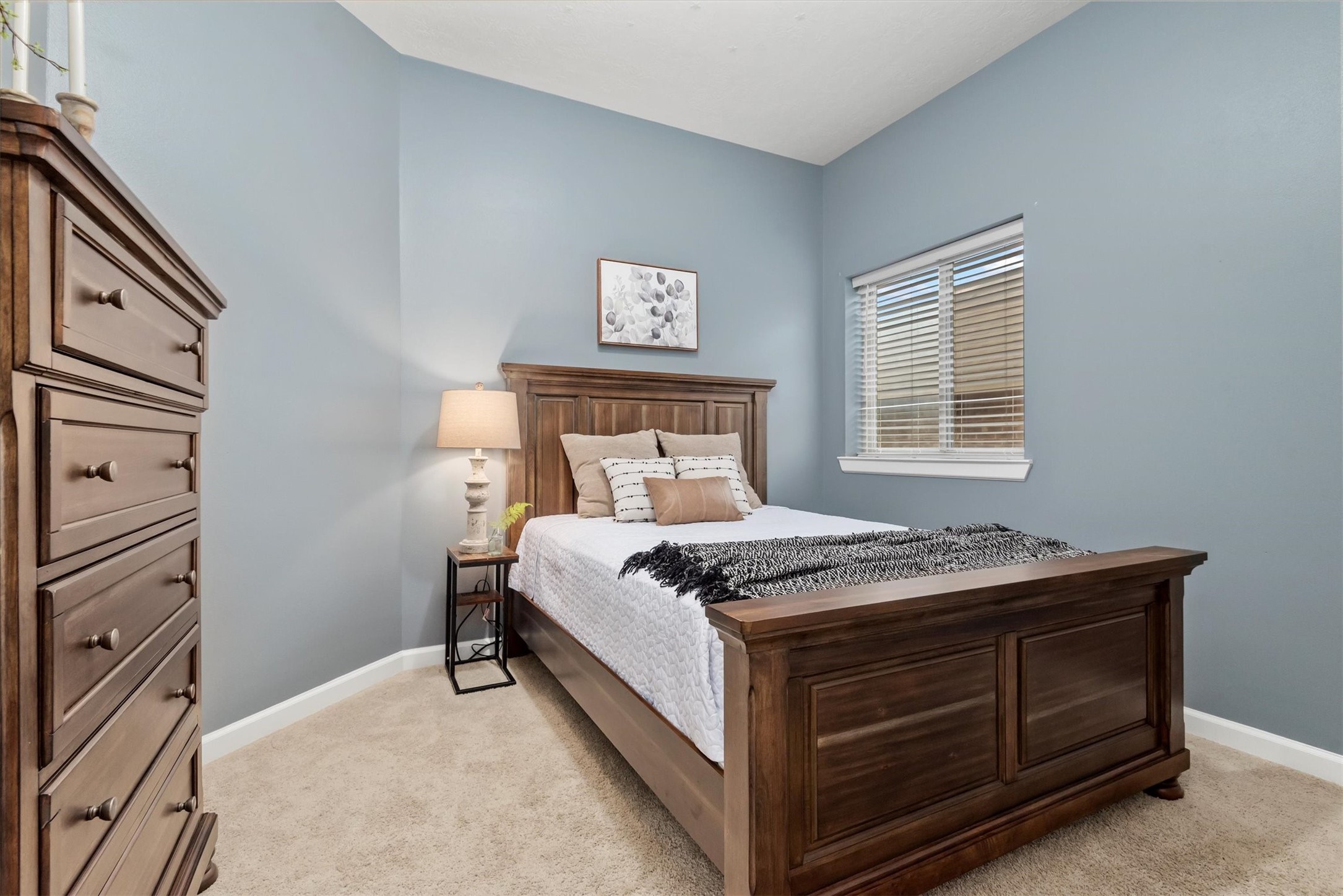 31563 Ember Trail Lane Spring, TX 77386 - Photo 25 of 39 a bed sitting in a bedroom next to a window