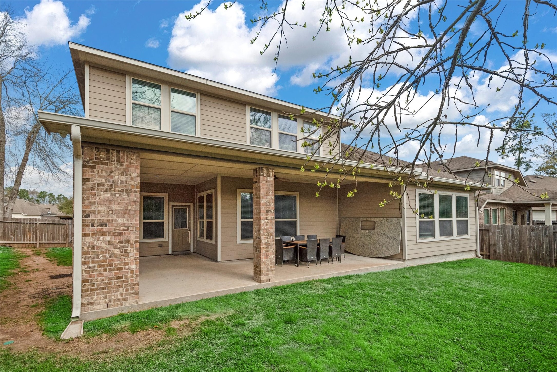 31563 Ember Trail Lane Spring, TX 77386 - Photo 4 of 39 This covered back porch is perfect for entertaining and relaxing. Imagine enjoying your morning cup of coffee or favorite book right here. This is ideal for a family gathering or BBQ.