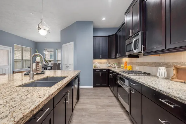 a living room with furniture fireplace and flat screen tv