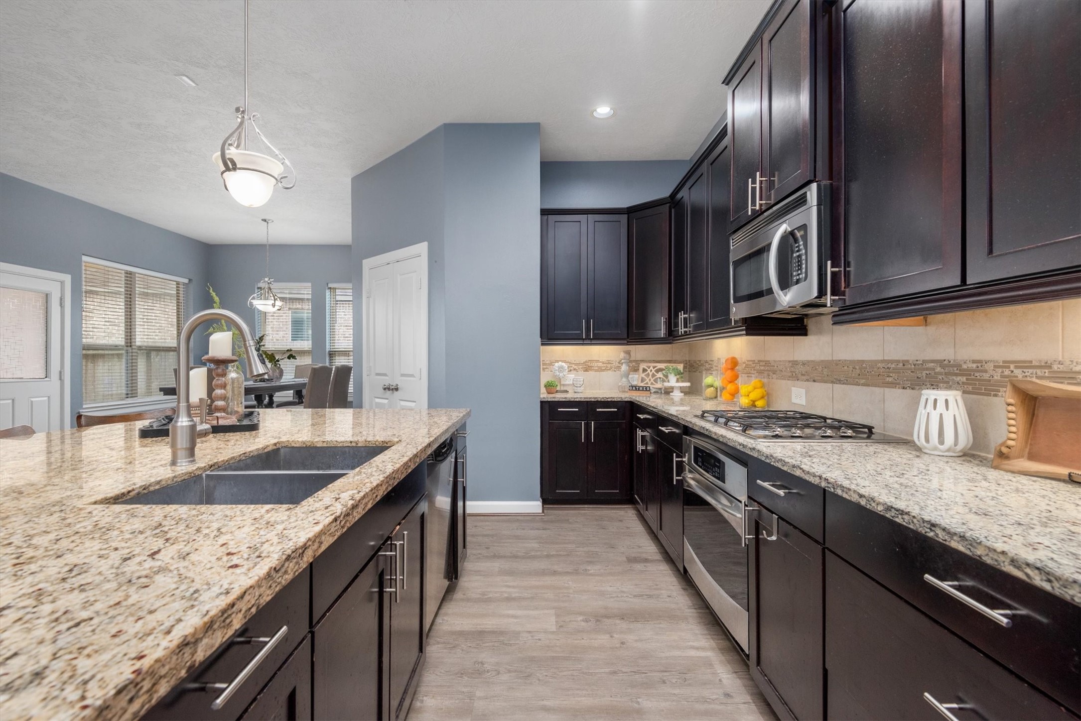 31563 Ember Trail Lane Spring, TX 77386 - Photo 10 of 39 a kitchen with granite countertop stainless steel appliances and sink