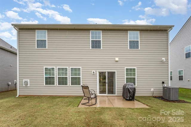 a backyard of a house with seating space
