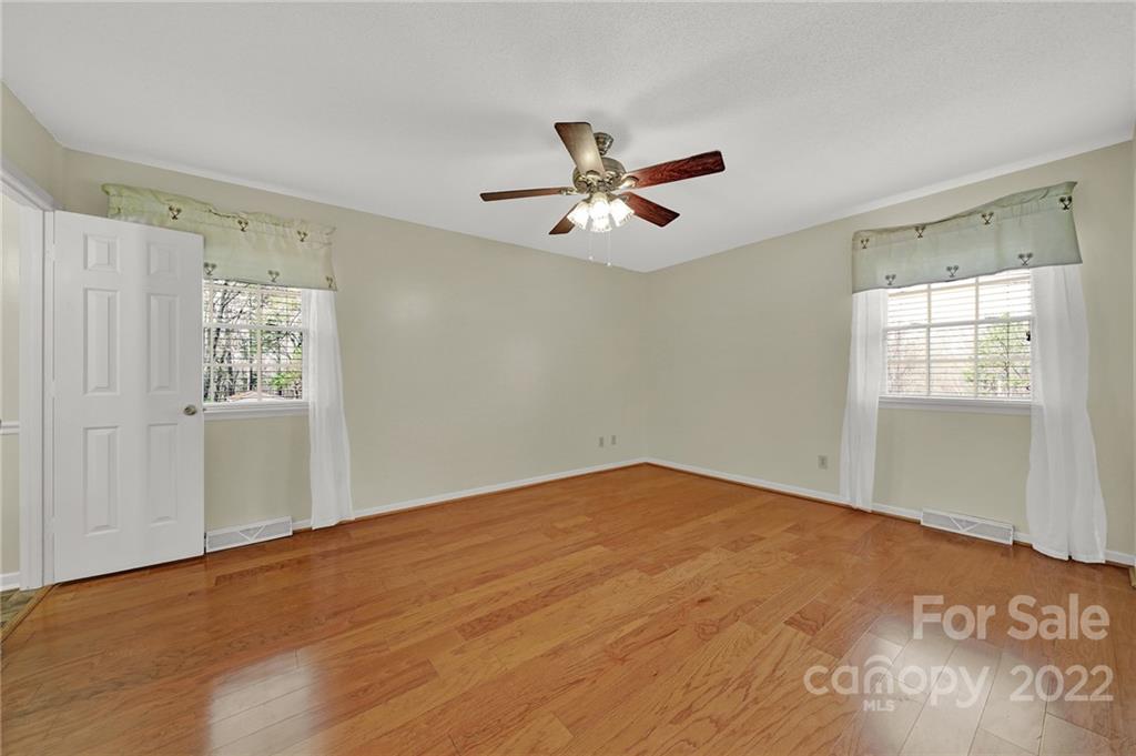 311 Maple Street, Unit 7 Union, SC 29379 - Photo 16 of 34 an empty room with windows and fan