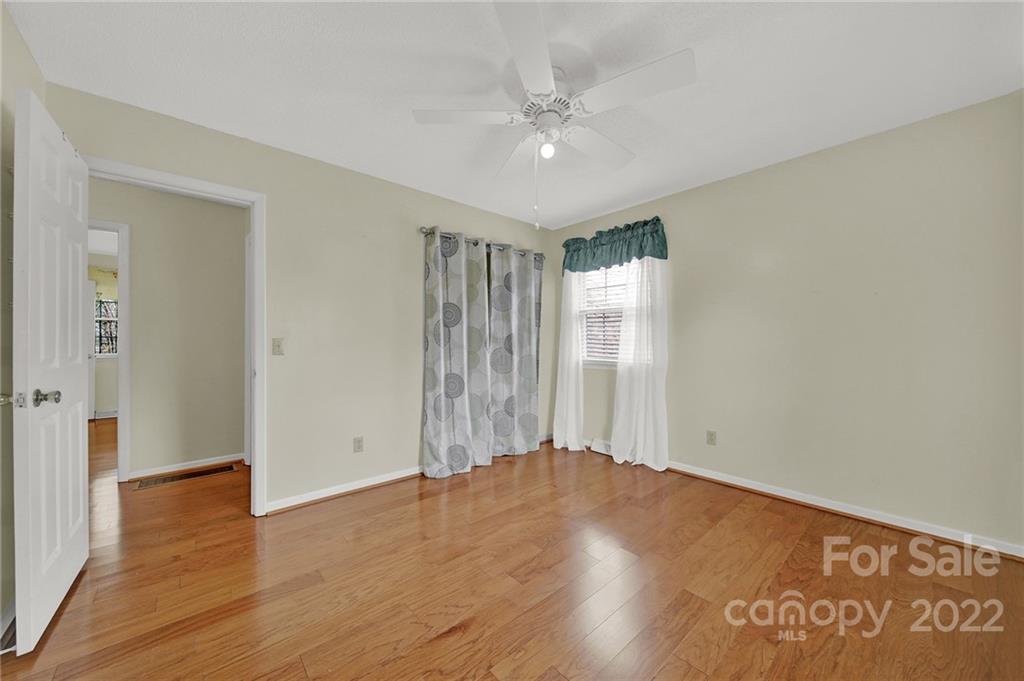 311 Maple Street, Unit 7 Union, SC 29379 - Photo 24 of 34 an empty room with wooden floor and window