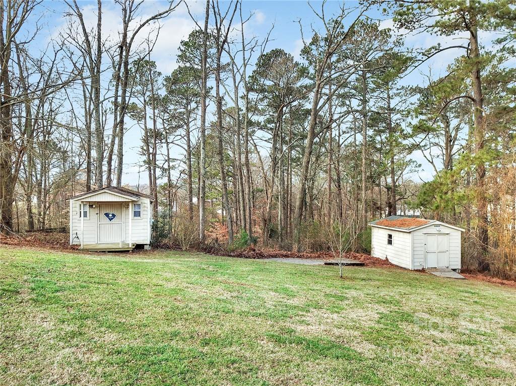 311 Maple Street, Unit 7 Union, SC 29379 - Photo 29 of 34 a view of a house with a yard and large trees