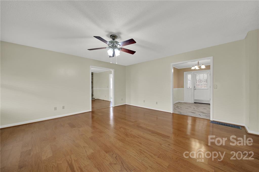 311 Maple Street, Unit 7 Union, SC 29379 - Photo 4 of 34 a view of an empty room with wooden floor and a window