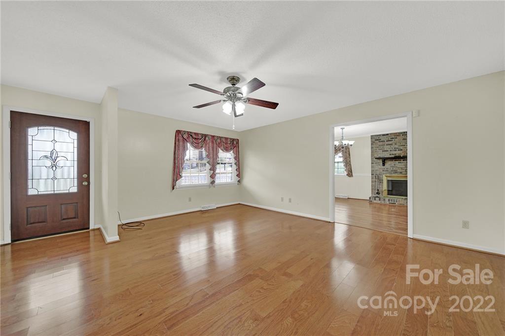 311 Maple Street, Unit 7 Union, SC 29379 - Photo 5 of 34 wooden floor in an empty room with a window