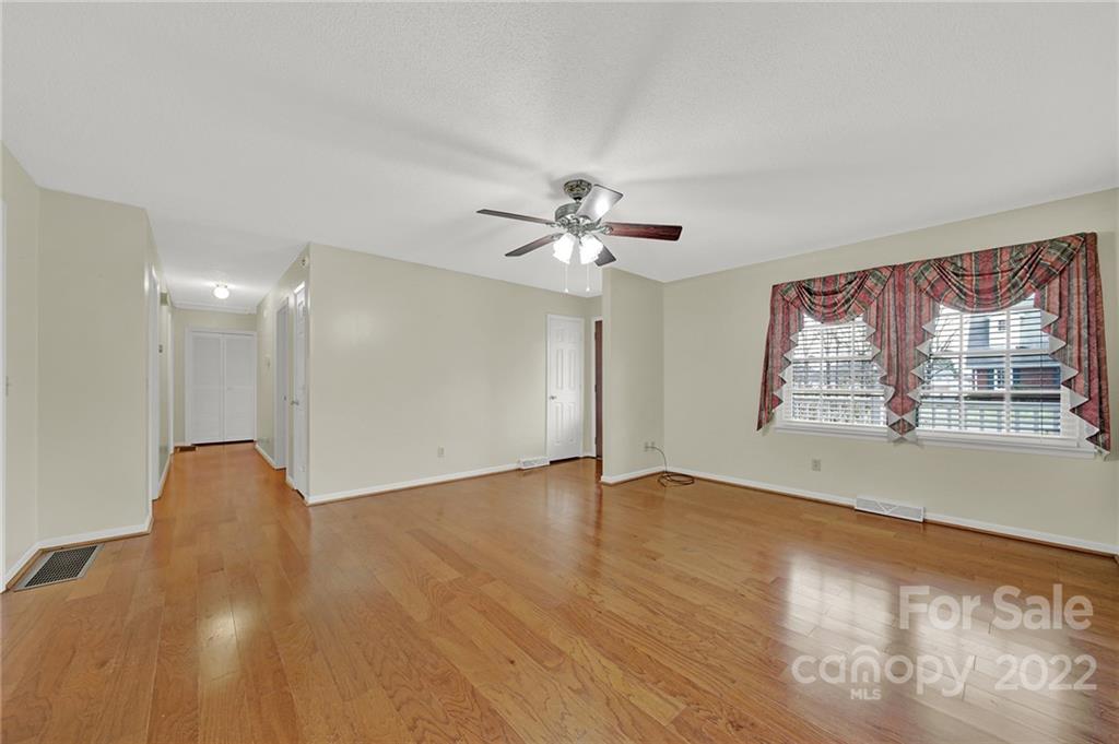 311 Maple Street, Unit 7 Union, SC 29379 - Photo 6 of 34 a view of an empty room with a window and wooden floor
