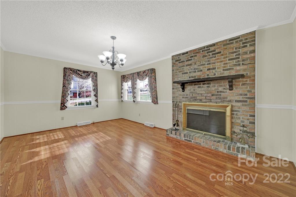 311 Maple Street, Unit 7 Union, SC 29379 - Photo 7 of 34 a view of livingroom with window fireplace and wooden floor
