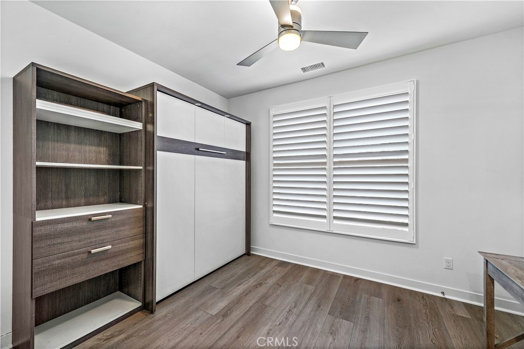 1309 Doheny Way Dana Point, CA 92629 - Photo 30 of 45 a view of an empty room with a window and wooden floor