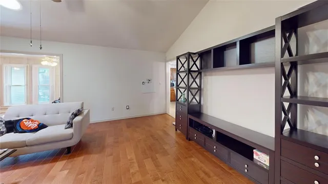 a hallway with furniture and a potted plant