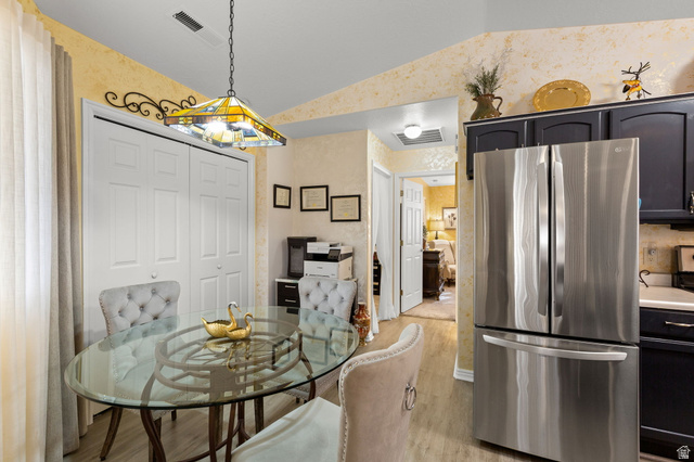 1225 North Dixie Downs Road, Unit 161 St. George, UT 84770 - Photo 8 of 21 Kitchen area featuring a stainless steel French door refrigerator, dark cabinetry, and light countertops