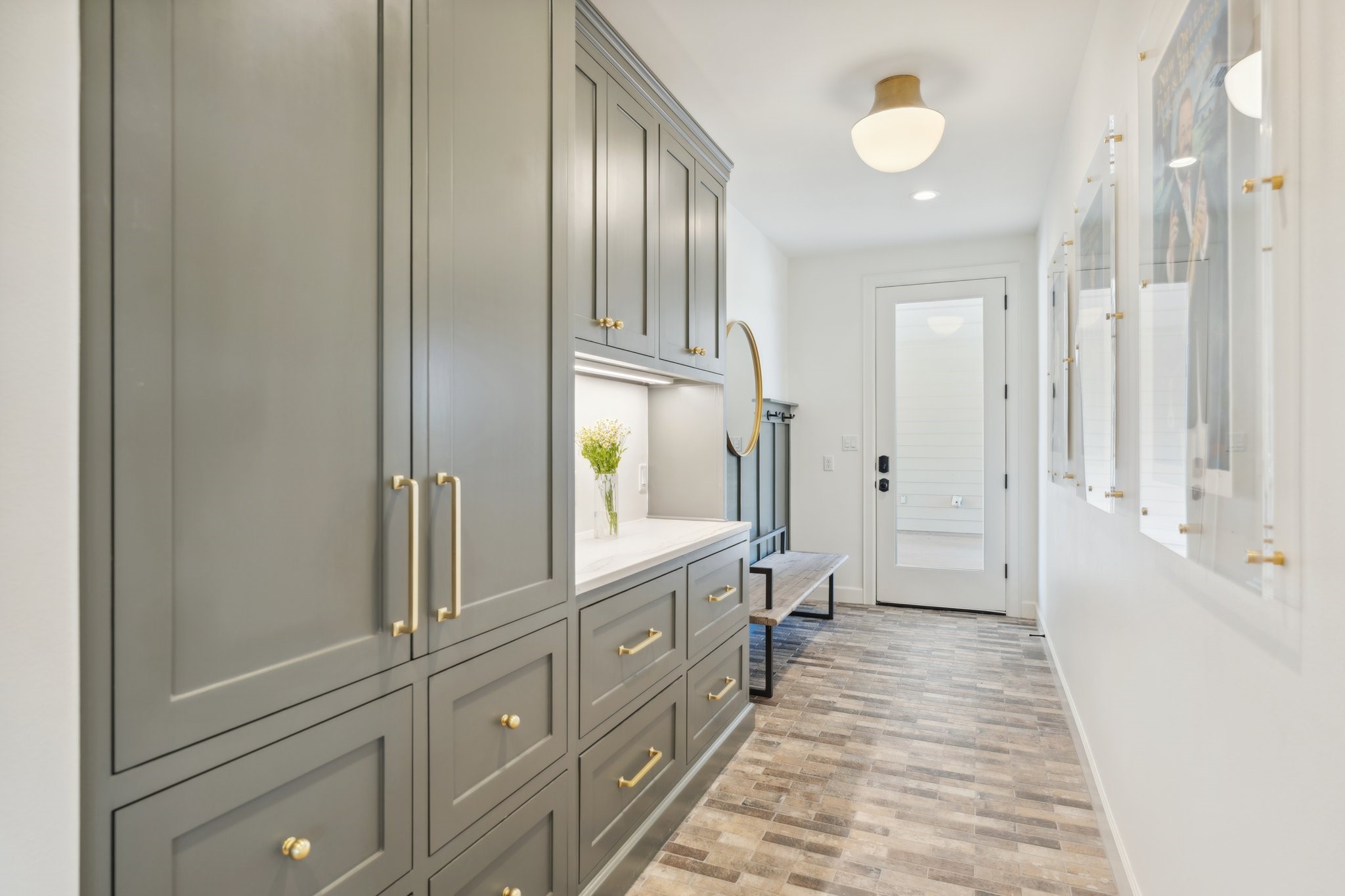 4052 Kuykendall Road Bellville, TX 77418 - Photo 16 of 40 Step into this inviting mudroom from the porte-cochere, featuring ample storage and sleek counter space for ultimate convenience and style.