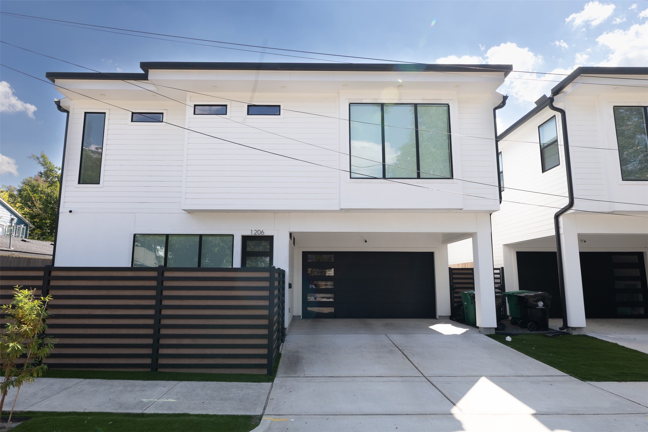 a front view of a house with garage