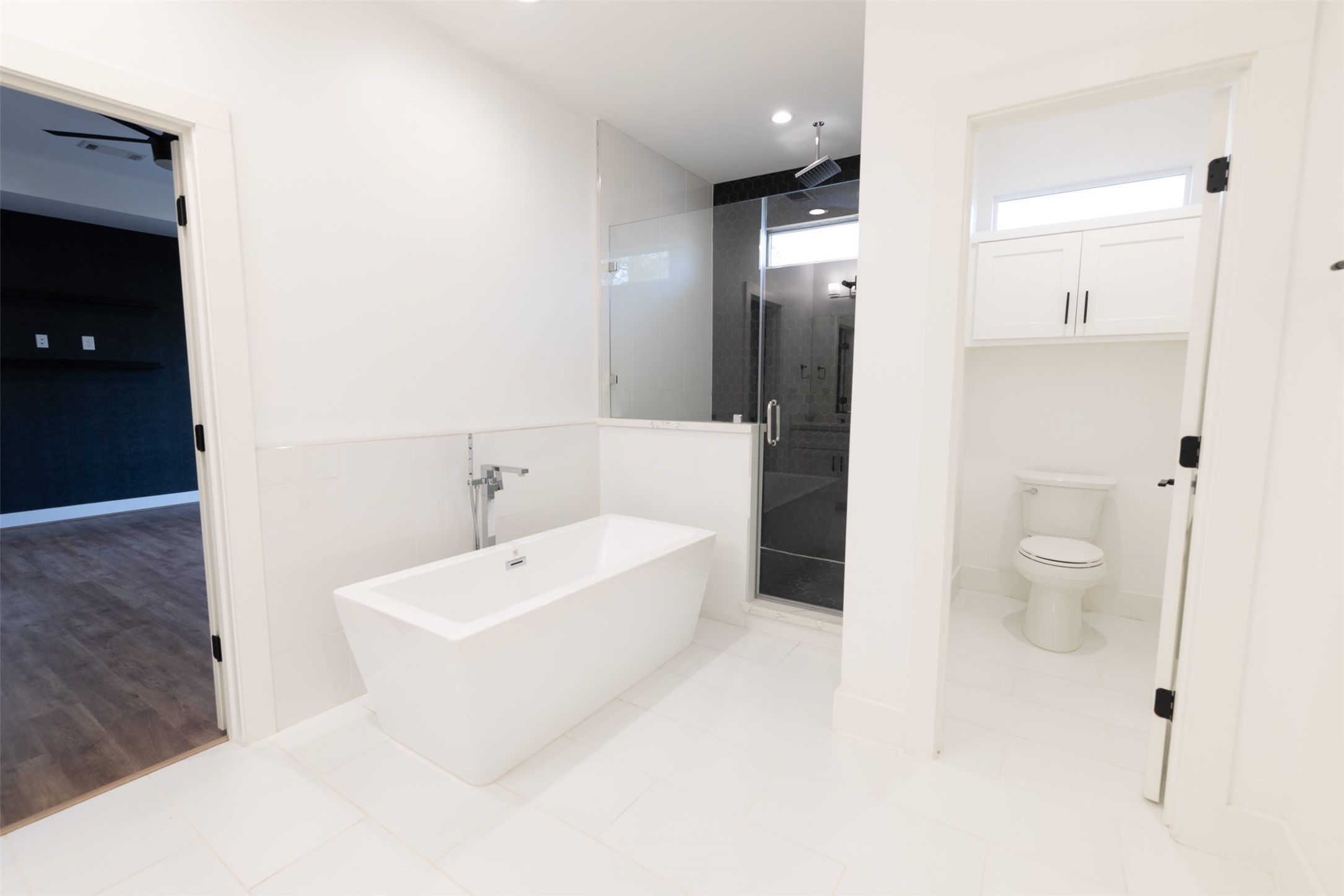 1206 Hamblen Street Houston, TX 77009 - Photo 16 of 28 a bathroom with a white tub shower sink and mirror