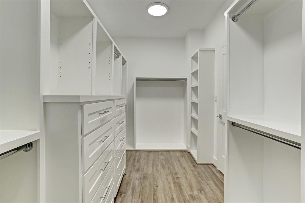 1206 Hamblen Street Houston, TX 77009 - Photo 17 of 28 a view of walk in closet with wooden floor
