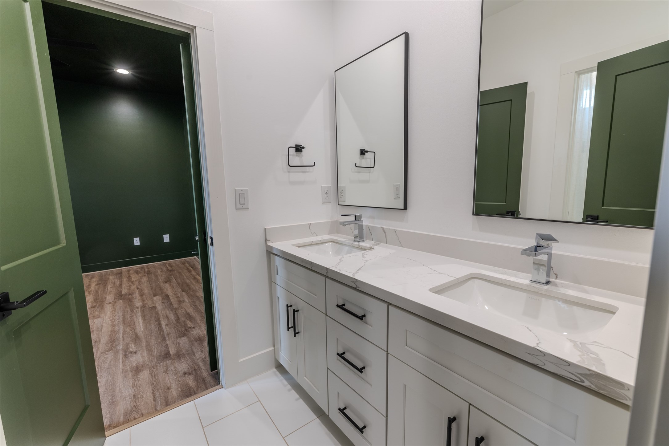 1206 Hamblen Street Houston, TX 77009 - Photo 23 of 28 a bathroom with a double vanity sink and a mirror