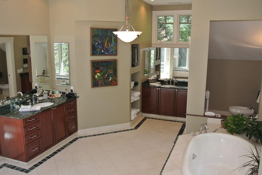 423 Concord Road Weston, MA 02493 - Photo 18 of 30 a spacious bathroom with a sink and a mirror