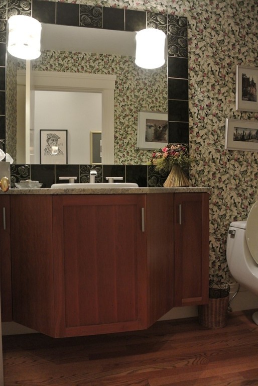 423 Concord Road Weston, MA 02493 - Photo 20 of 30 a bathroom with a toilet a sink and mirror
