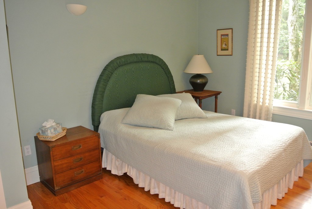 423 Concord Road Weston, MA 02493 - Photo 23 of 30 a bedroom with a bed and a window